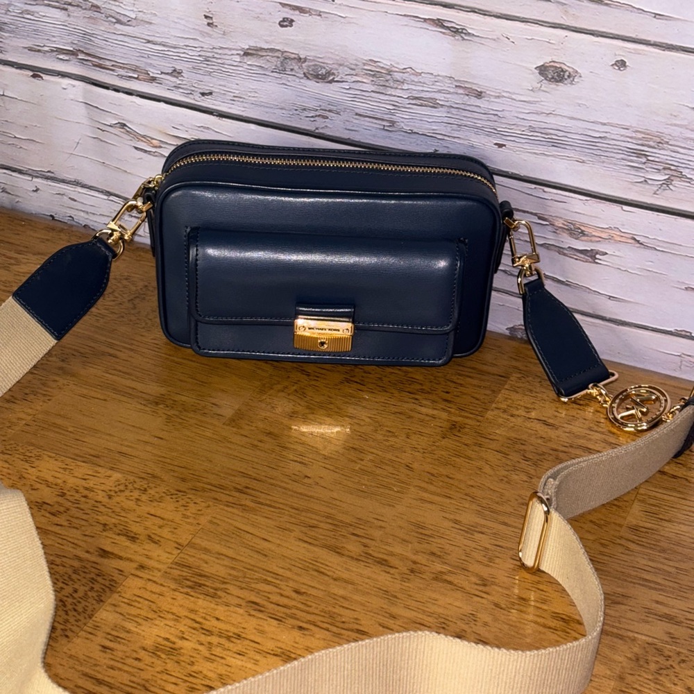 Michael Kors Bradshaw medium navy blue camera bag.
